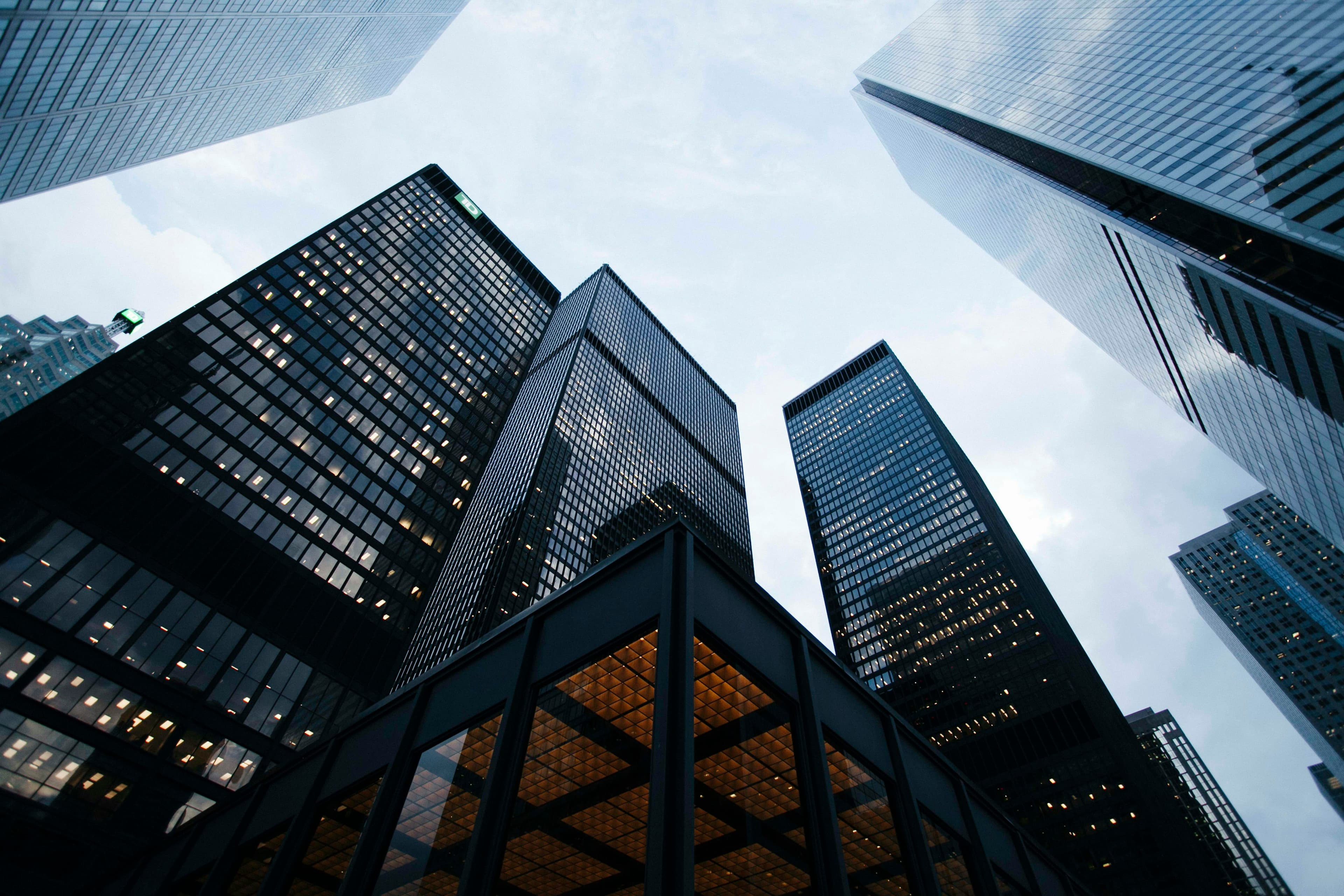 Modern city towers viewed from below, symbolizing scalable enterprise architecture and global operations