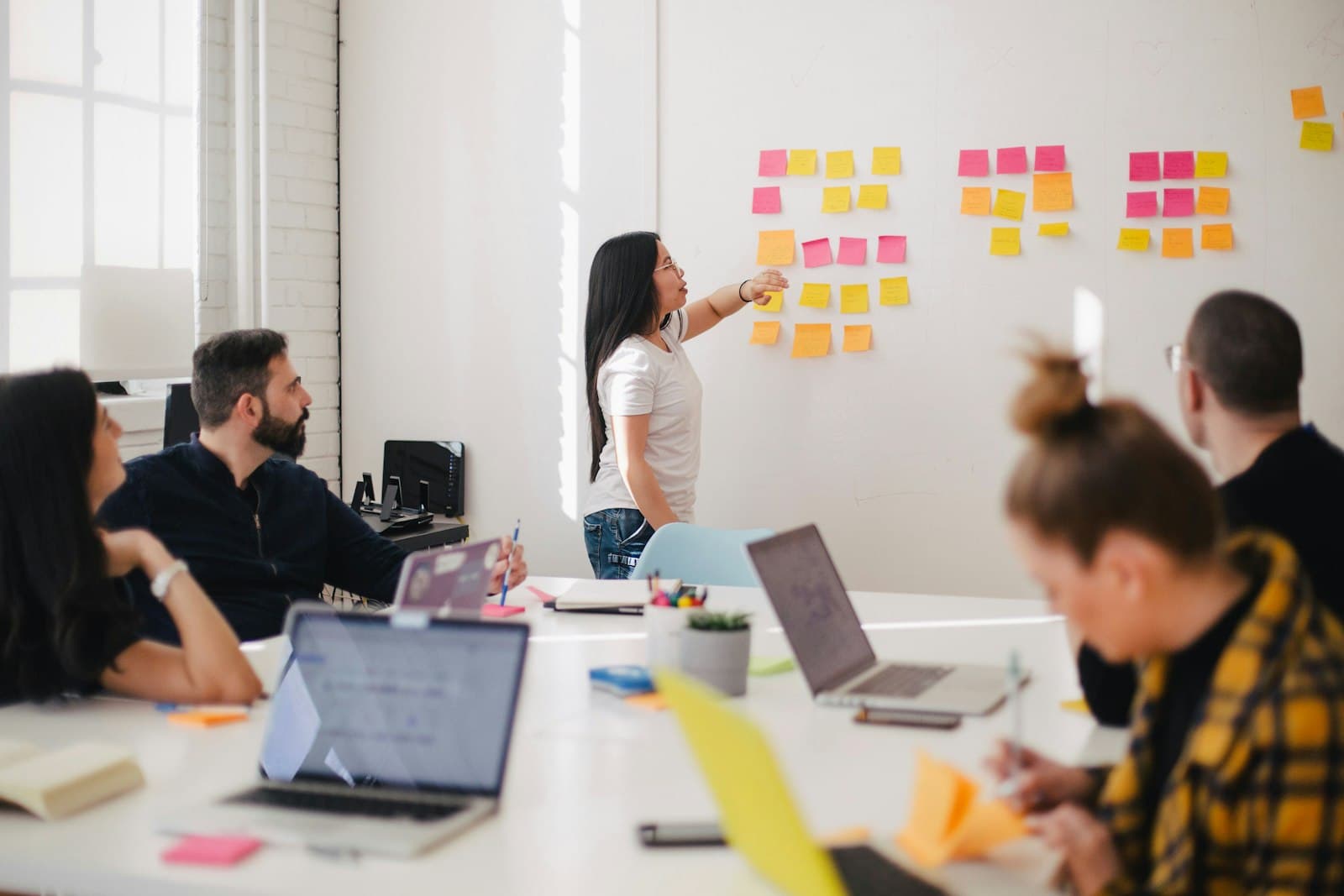 Leadership team collaborating at a conference table during an operating review