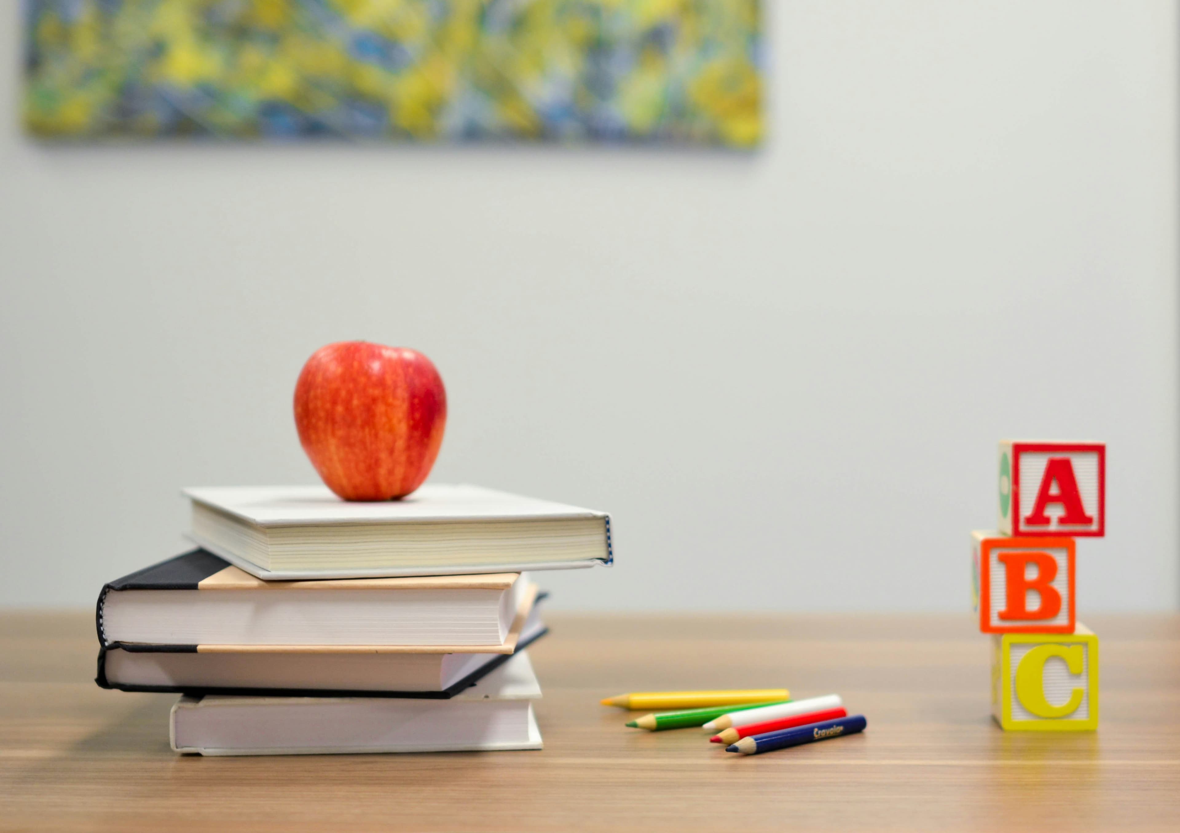 Open books on a desk, representing learning and school administration