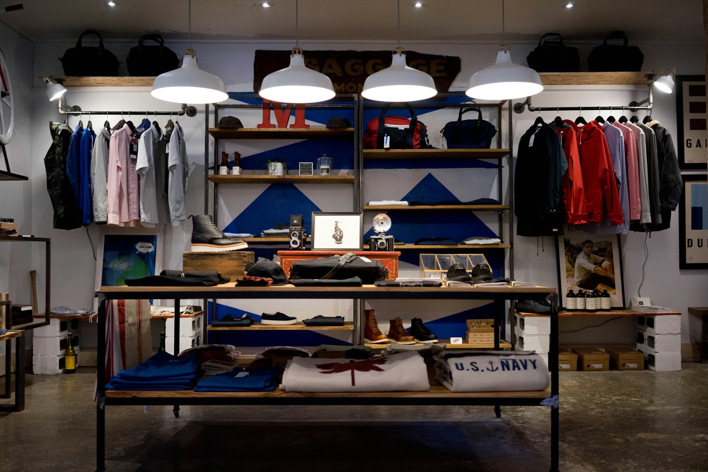 Retail store interior with clothing racks and warm lighting, omnichannel commerce